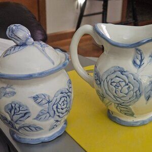 beautiful cream and sugar set decorated in embossed flowers PS port Merion FLEUR